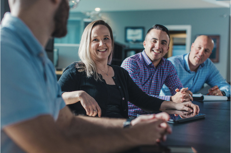 Guardian Jet's team discussing prominent business at morning meeting