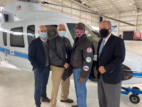 RedTail Flight Academy Receives Donated Helicopter - Pictured: Mike McCafferty, Guardian Jet; Carlos Rodriguez and Glendon Fraser, both of RedTail Flight Academy; and Don Dwyer, Guardian Jet